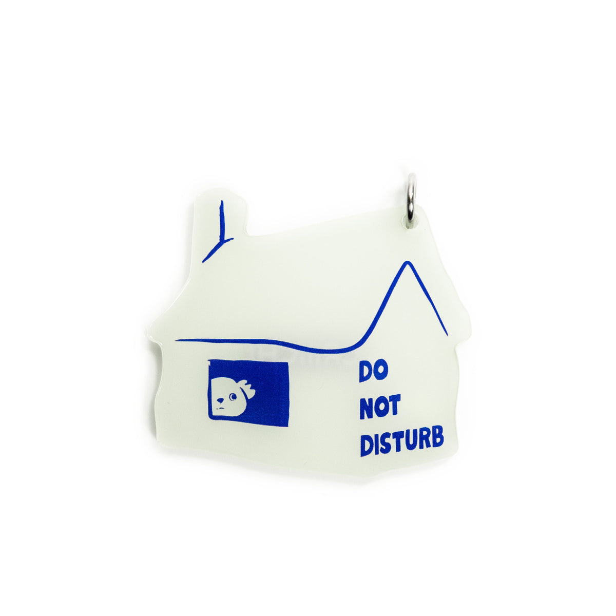 A small house-shaped pendant or charm in white with blue line art, a blue window graphic with a small face, and the words 'DO NOT DISTURB' printed in blue, shown on a plain white background.