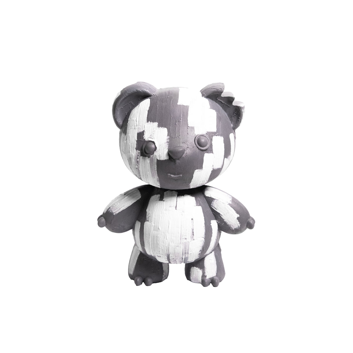 A small stylized bear figurine with a black and white brushstroke pattern, standing against a plain white background.