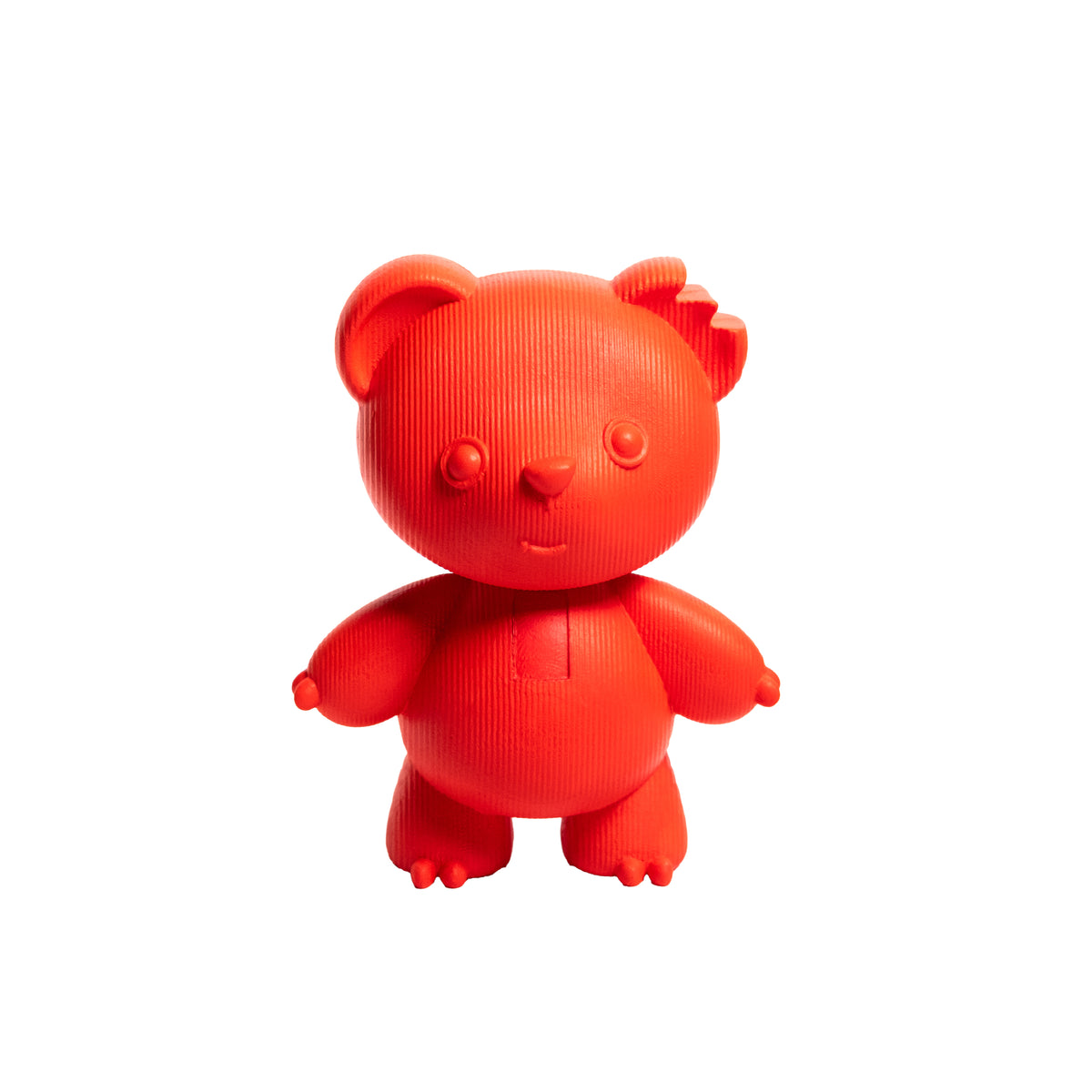 A small orange bear-shaped figurine or toy with a ribbed texture, standing against a plain white background.