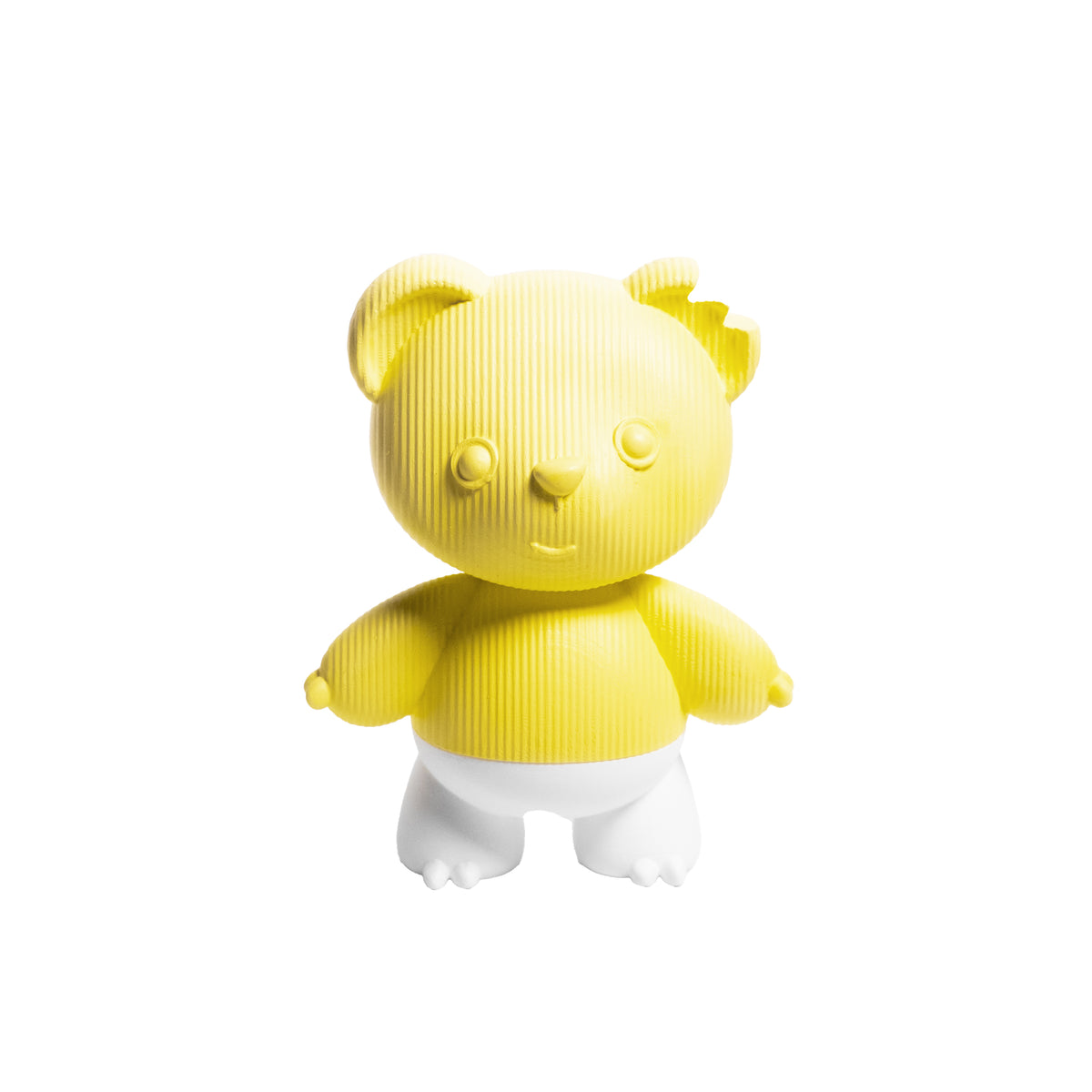 A yellow and white textured teddy bear figurine standing against a solid white background.