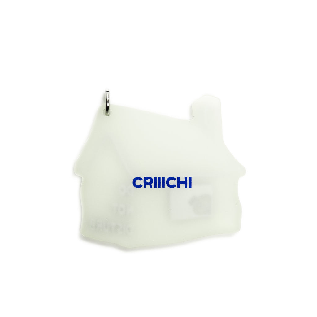 A translucent white silicone house-shaped charm with a silver metal loop at the top and the blue brand name 'CRIIICHI' printed on the front, shown against a plain white background.