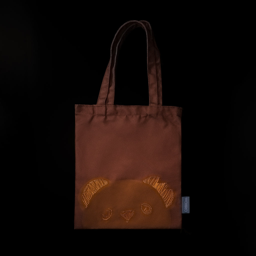 Brown color tote bag with embroidered orange thread