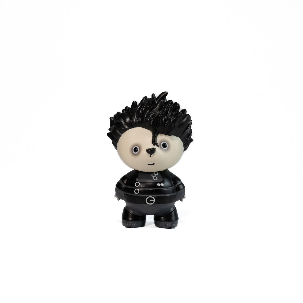 Toy figure with black spiky hair and a black outfit inspired by Tim Burton movie Edward Scissors Hand