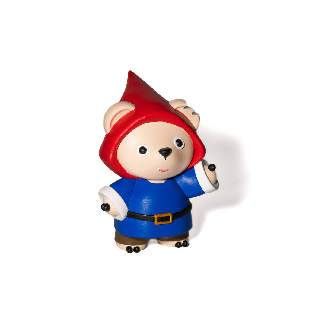 Hand painted toy figure of a character wearing a red hat and blue seasonal outfit 