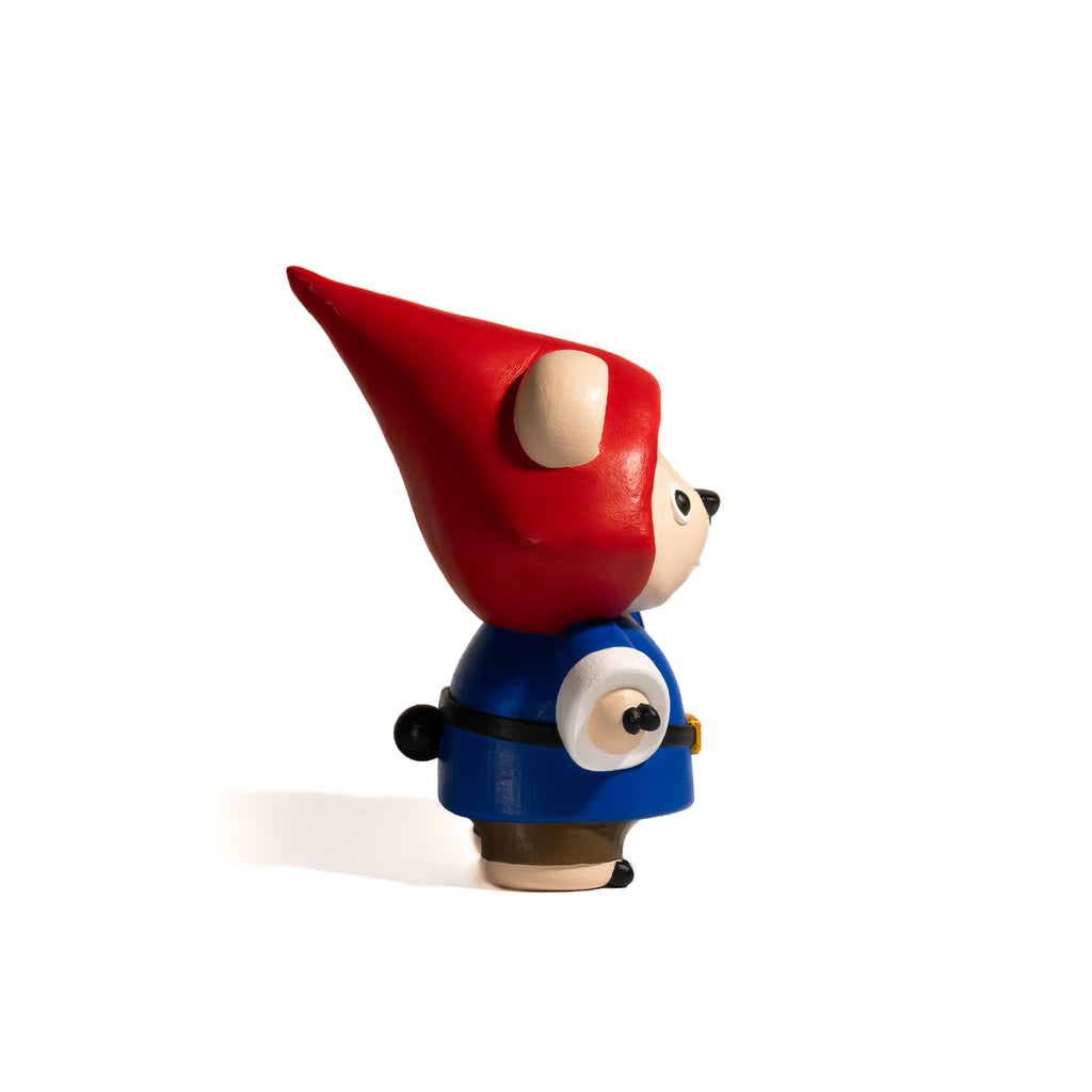 Hand painted toy figurine of a gnome with a red hat and blue seasonal outfit