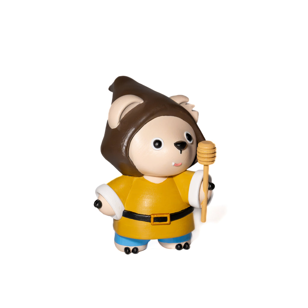 Designer Toy figure of a character with a brown hat and yellow seasonal gnomes outfit
