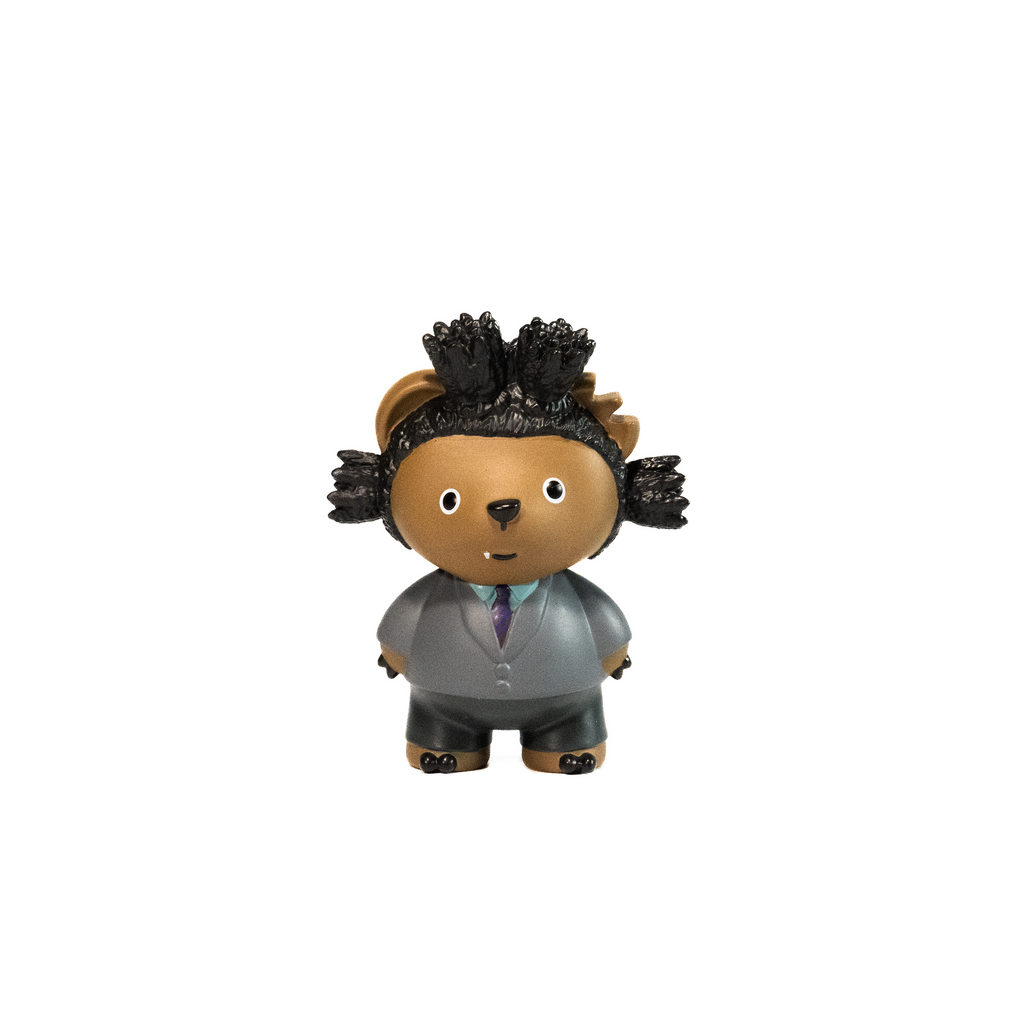 Toy figure of a character in a suit inspired by Jean-Michel Basquiat