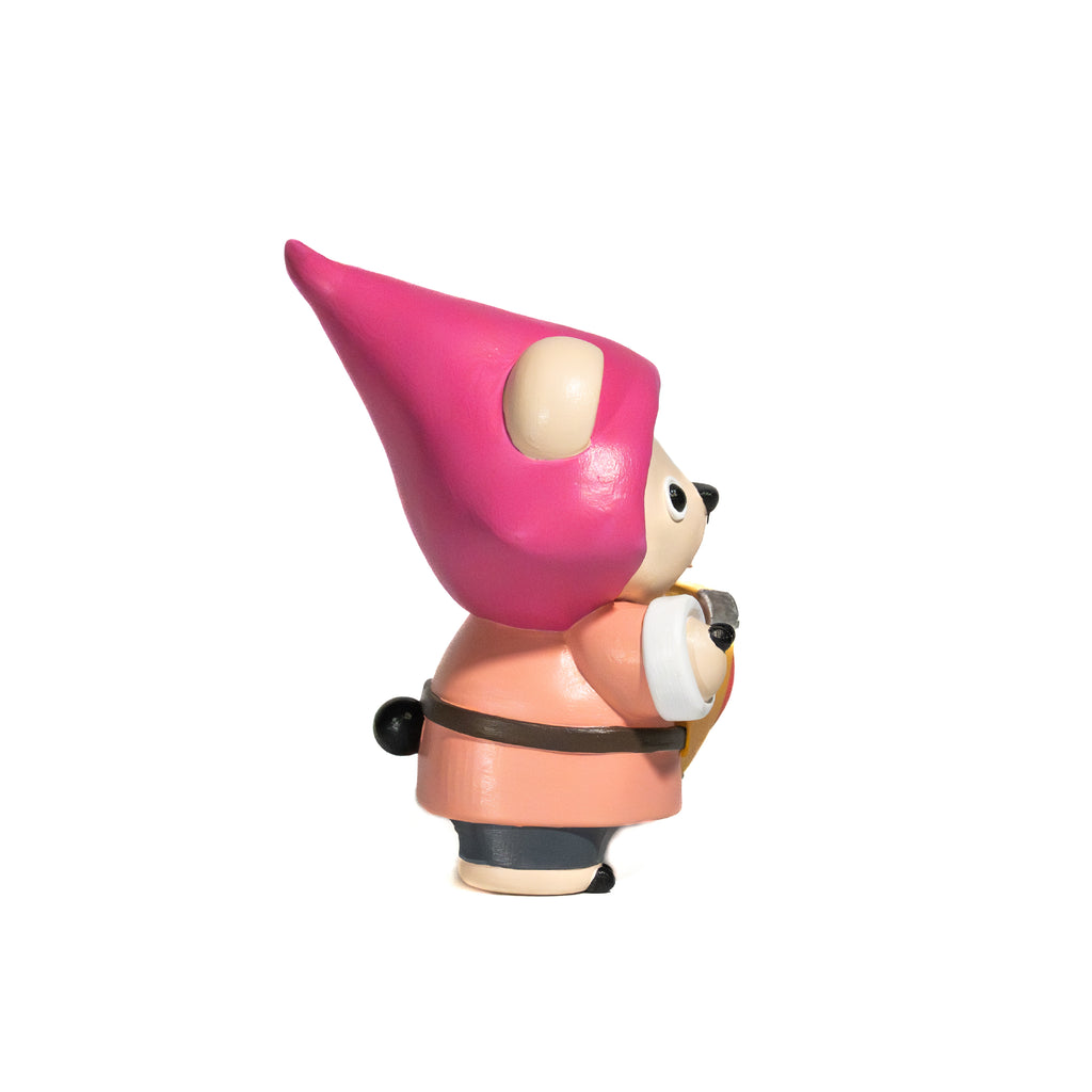 Toy figure of a bear wearing a pink hat and peach-colored costume holding a heart-shaped shield