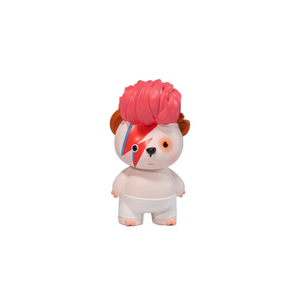 Toy figure with pink hair and a blue stripe, resembling a famous musician, inspired by David Bowie